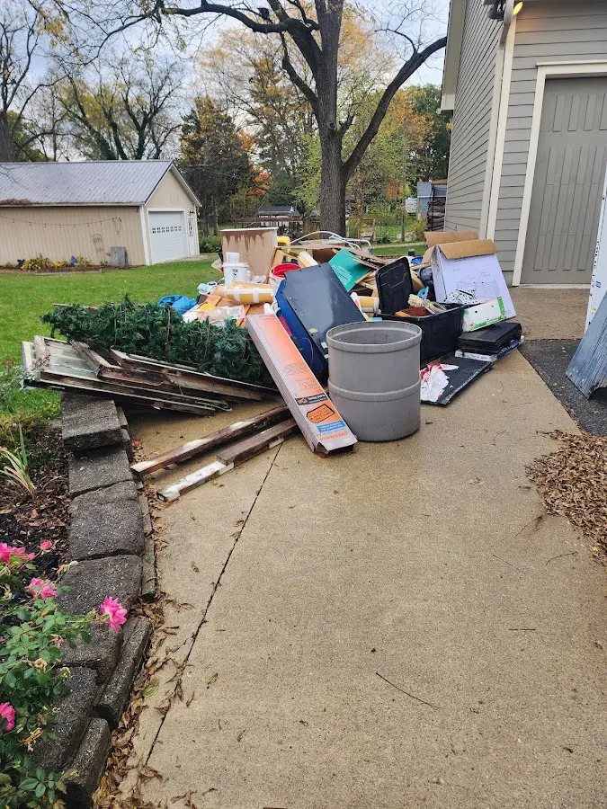 Dumpster being loaded with debris for 30 Yard Dumpster Rental in Taylorsville